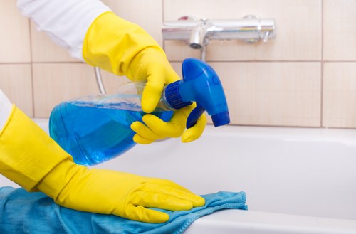 Local carpet cleaners treating a carpet stain with care